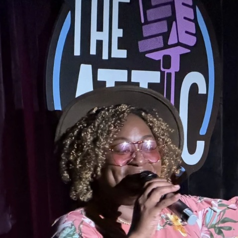 Sista Lu on stage at The Attic Comedy Club